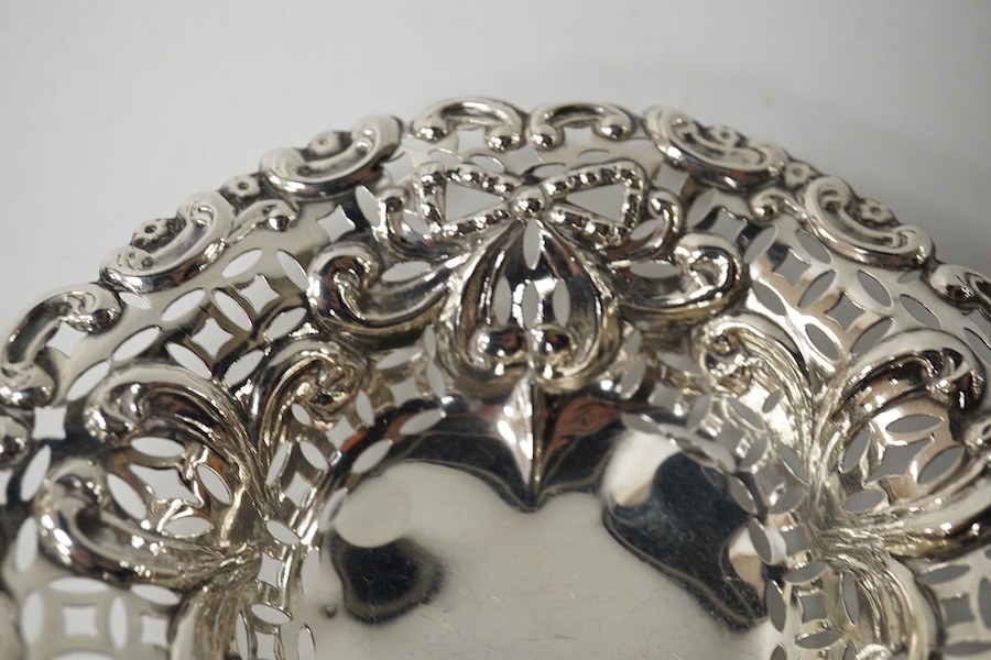 An embossed white metal bon bon dish (a.f.) 11cm and a pair of smaller late Victorian silver bon bon dishes. Condition - poor and good